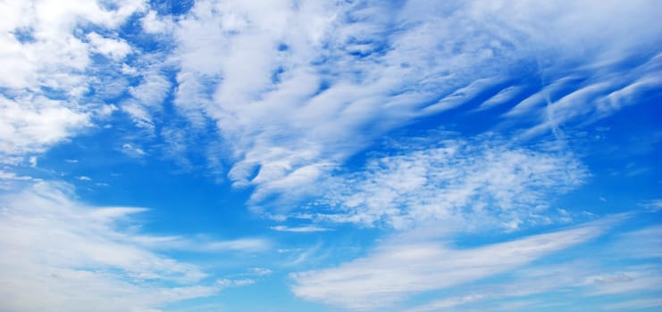 Blue sky background with a tiny clouds