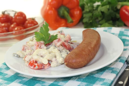 Mettenden with pasta salad against a white background