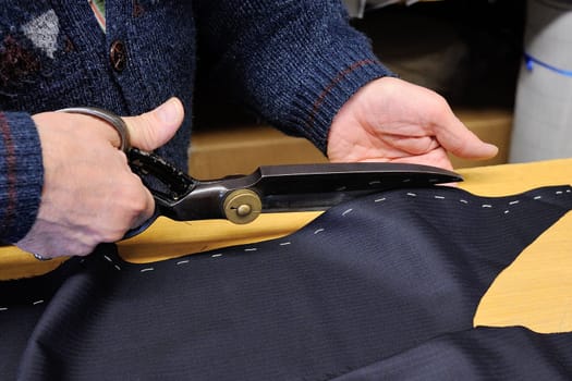 Handwork of bespoke suit, made by traditional tailoring of Sardinia.
