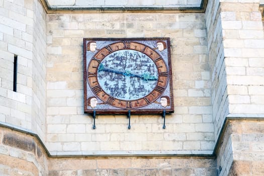 Antique clock on the facade in the cathedral of leon in Spain