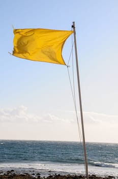 Yellow Festive Flag Waving In The Wind Tenerife Canry Island Spain