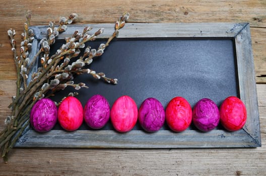 colorful Easter eggs wooden background