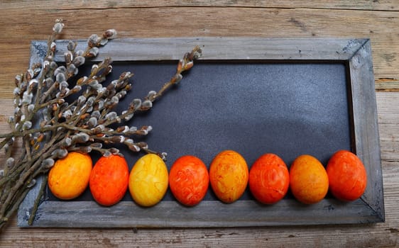 colorful Easter eggs wooden background