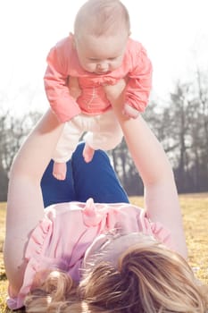 Mother and daughter on a sunny day in the field
