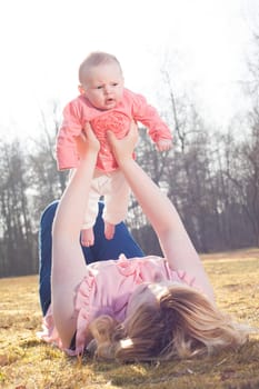 Mother and daughter on a sunny day in the field