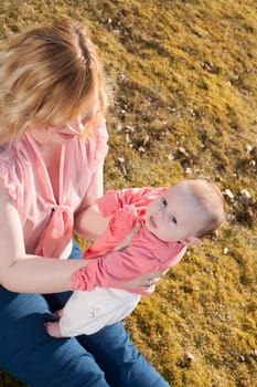 Mother and daughter on a sunny day in the field