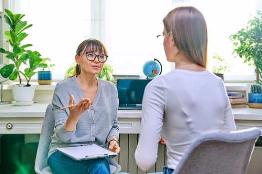 Psychologist, social worker, behavior talking with teenage girl student, counselor with clipboard. Psychology psychotherapy therapy, adolescence youth, social life, mental health concept