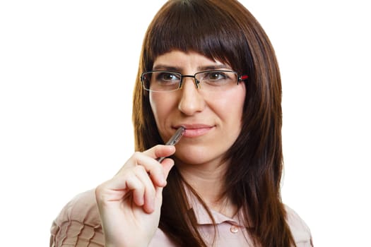 Young pensive girl in glasses with a pen on a white background
