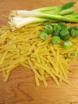 Narrow ribbon noodles and spring onions