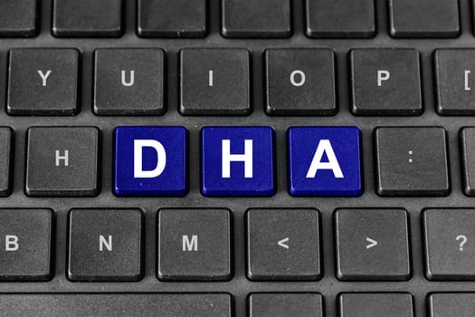 Docosahexaenoic acid or DHA blue word on keyboard
