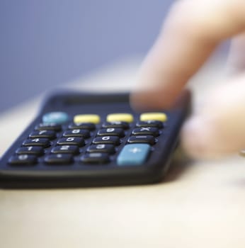 Black computer and coins - Calculating my money