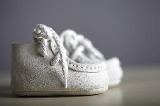 Close up photo of a pail of small slippers for toddlers