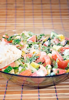 Healthy salad with vegetables and cheese