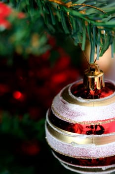 Close up of Christmas ornaments on tree.