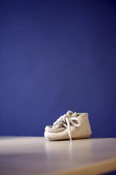 Close up photo of a pail of small slippers for toddlers