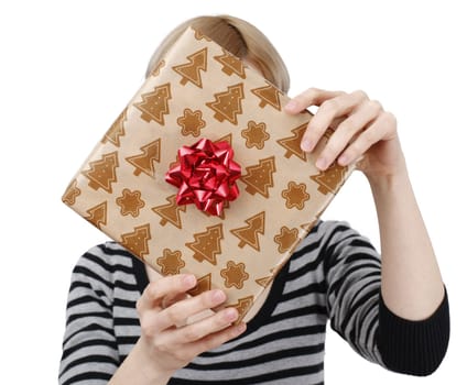 Young woman holding a present in hands