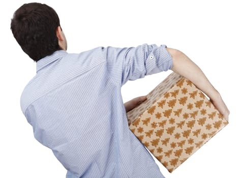 Young man holding a present in hands.