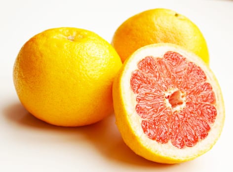 Fresh composition of yellow and red grapefruits.