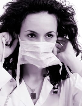 Doctor with stethoscope isolated on white.