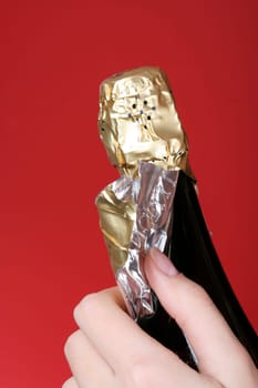 Woman hands opening champagne bottle