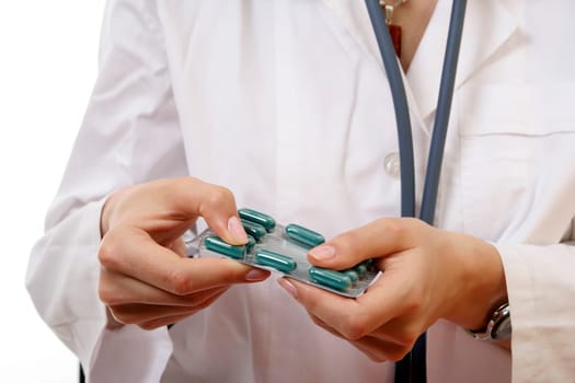 Doctor with drugs in her hands.