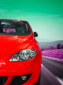 Image of a car viewed from the front on the highway