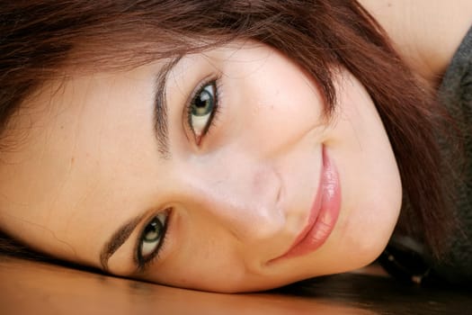 Portrait of a happy beautiful woman with green eyes.