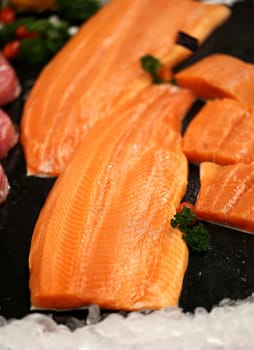 red fish lying on ice in a shop window