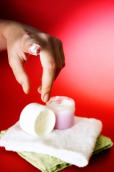 Moisturizing cream on red background