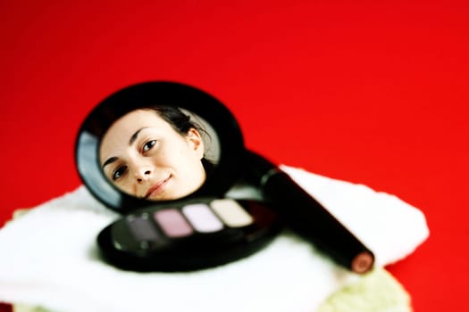 Cosmetics isolated on red background