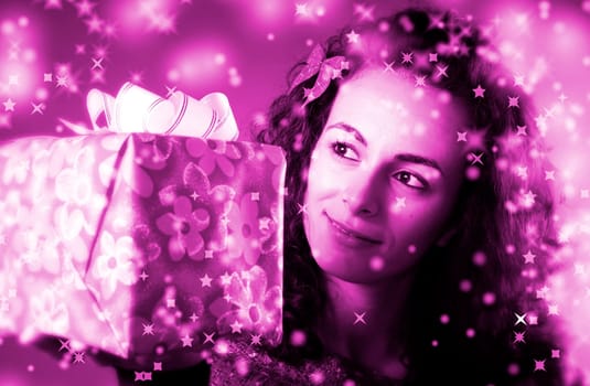 woman with a gift in her hands and snowflakes