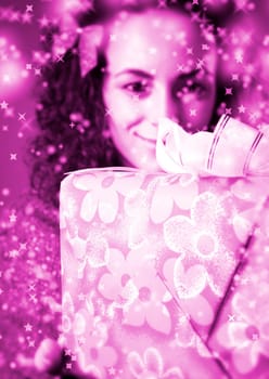 woman with a gift in her hands and snowflakes