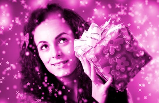 woman with a gift in her hands and snowflakes