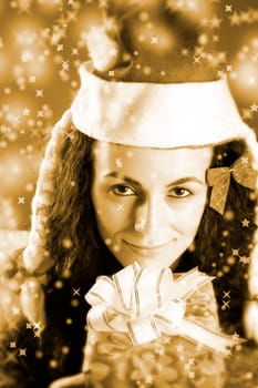 woman with a gift in her hands and snowflakes