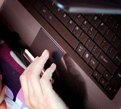 Young woman working at laptop.