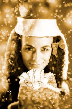 woman with a gift in her hands and snowflakes