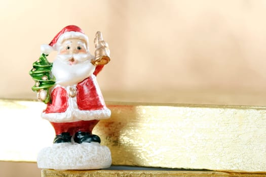 Santa claus and big yellow present box.