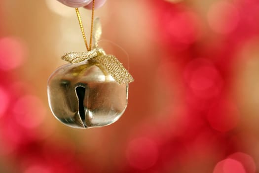 Close-up of yellow christmas ringer.