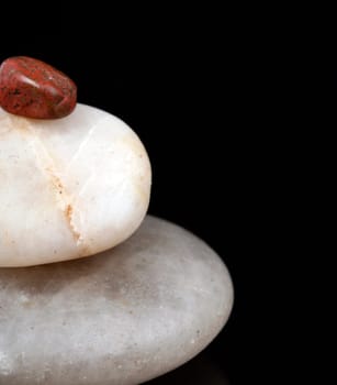 Concept made by many rocks isolated on black.