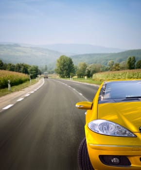 Fast car on the road.