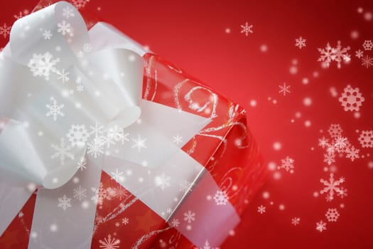 Present box isolated on red background.