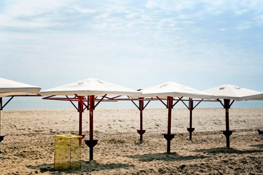 White umbrellas on the beach.