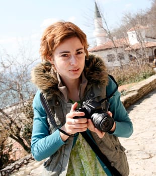 professional woman photographer at work.