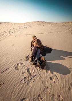 Photo of woman with bag lost in desert