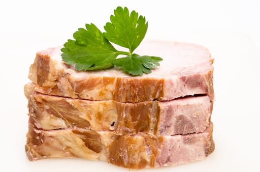 Three slices of Kassel meat with green parsley