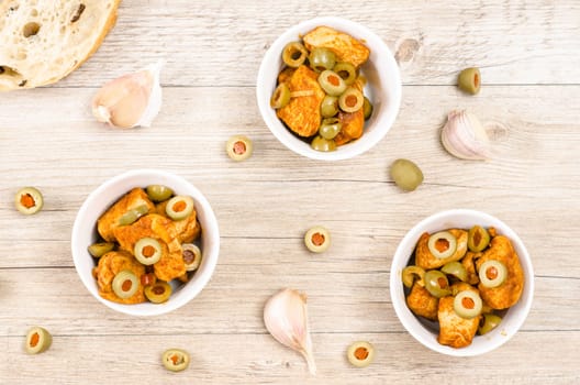 Roasted chicken breast with green olives and garlic