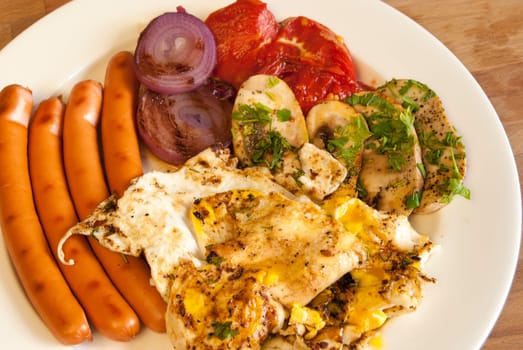 Plate with homemade English breakfast on wooden background