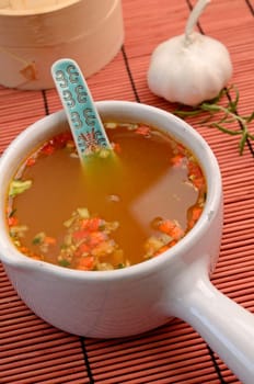 Asian soup an a bamboo mat