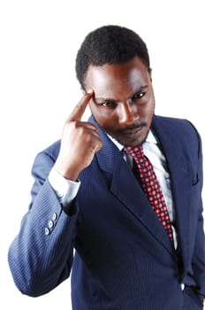 A handsome young black man in a blue suit with one finger on his.forehead, isolated for white background..