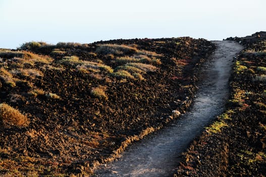 Travel Concept Background - Pathway in the Volcanic Desert Tenerife Canaty Islands Spain
